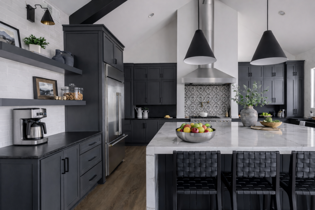 Modern black kitchen remodeling with custom cabinetry, waterfall island, and design-build craftsmanship in Tampa Bay.